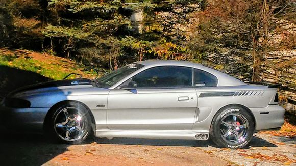 1998 mustang gt side scoops and svo side skirts.  Black saleen wing