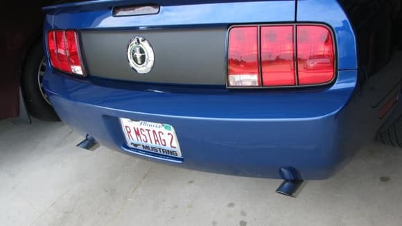 Tips stick out about 2 1/2&quot;, but they're not beyond the top edge of the bumper.