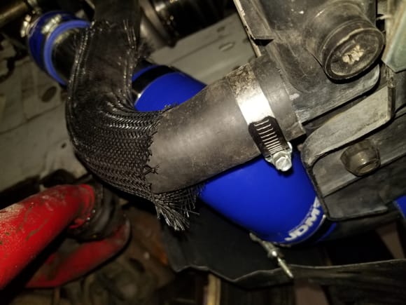 This is where things go from nice and pretty to ugly AF....  Its a 90* Rubber connector i'm going to have to monitor this for chaffing. This is start of the wrap round the radiator.