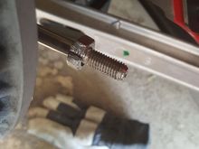 This nut stripped all its threads, and then couldn't be removed.  I ended up cutting it off with a Dremel tool.