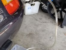 Attached clear hose from AC pipe to gallon jug.