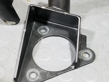 bracket mounts over spring 