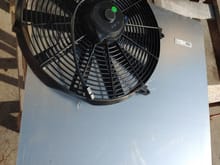 16 Proform Fan 2100 CFM, this fan barelt fits and is larger than the radiator itself. So I am making a poor man's fan shroud out of aluminum sheet metal. This when finished will bolt up to the factory radiator fan mounts.