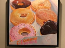 My sis is an artist. I’m not a huge fan of Dunkin, or donuts in general, but I like the whimsy of this piece 