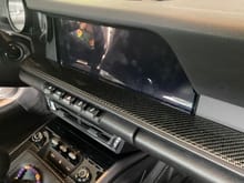OEM CF passenger trim installed - close up