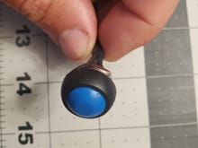 Low profile button with lock nut on the back.