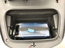 Inexpensive luggage my wife found at target fits perfectly in the frunk.