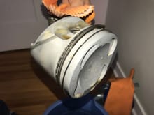 See the stain on the side of piston head.