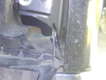 At the very bottom you can see two thin pieces of metal. One is from the fender and the other is from the A pillar chasis. What screw could go there? Also you can see the other bottom hole that needs a screw.