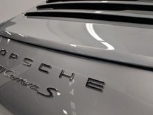 Chrome-look emblems were to be replaced with simplified matte black emblems.