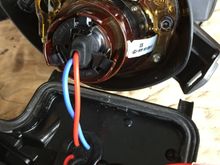 modified retaining clip to accommodate the wire passing through. drilled hole for wires to get out to the ballast and back in (w grommet).