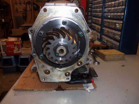 Pinion gear of differential still mounted on output shaft of transmission.