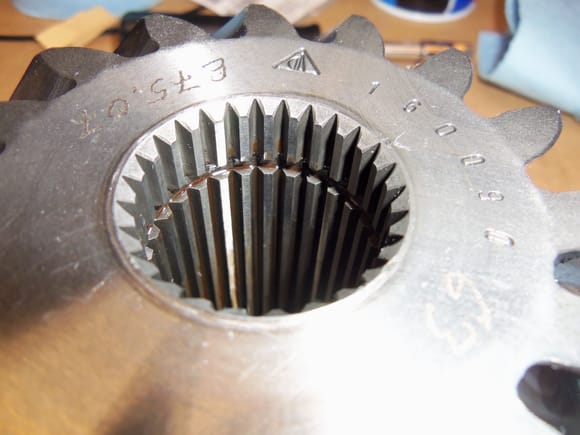 One of my experts explained to me that the O-ring was INSIDE the center of the pinion gear. Oh...
Note the groove in the splines. 