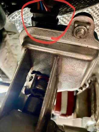 Reverse angle shot from underneath vehicle above pipe and shooting aft.  Electrical connector circled.