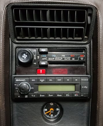 Continental TR7412UB-OR (off). The radio was purchased from Tore at https://www.bergvillfx.com. I wish it was narrower like the climate control width, but it still looks pretty good in this 1982 928.