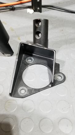 bracket mounts over spring 