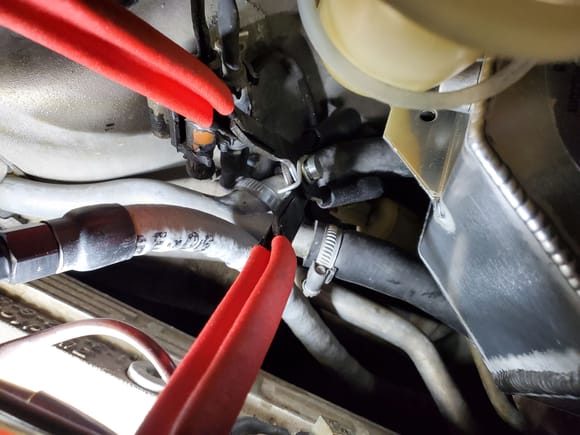Angled Spark plug wire pliers used to pull coolant hose onto Y-pipe