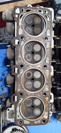 87 head with gasket. 38,000 miles. Note the early brown head gasket with the narrow fire ring.