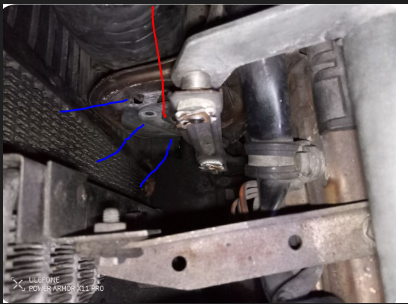I've gotten the 3 screws (blue arrows) and the 1 center screw (red arrow) off but can not wiggle the headlight motor our