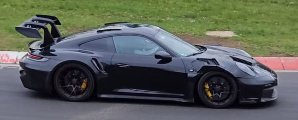 Top element looks bigger.  Hard to tell about the bodywork with all the camo.  This could still be a facelifted 3RS but the exhaust sounds quieter than the current model...more like a turbo?