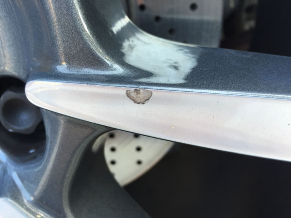 Hi all, just noticed this chip on rear wheel. Any tips or ideas on touch up - repair. If touch up paint, what color? Thanks