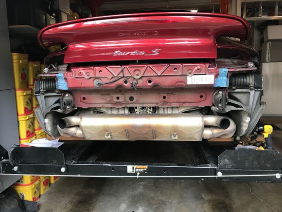 Remove the bumper and heat shield (2 screws and 2 bolts). Nothing difficult yet. Need to get access to the fasteners holding the exhaust system together. That's todays project