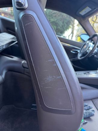 Before - cosmetic damage on side of airbag, also the brown paint on this was sticky so basically it was getting worse by even looking at it -- and the sticky paint problem aannoyingly reminded me of prior cars with sticky buttons... most of which I came to hate as a result. The 991 is too good for sticky paint. 