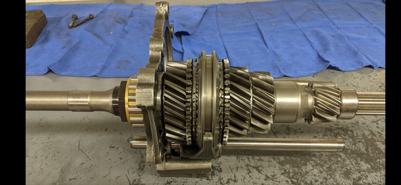  Input shaft assembly: shows pressing the input shaft’s cylindrical roller bearing on as the shaft is mated to the tensioning plate / gear interlock assembly.