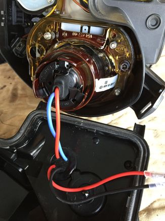 modified retaining clip to accommodate the wire passing through. drilled hole for wires to get out to the ballast and back in (w grommet).
