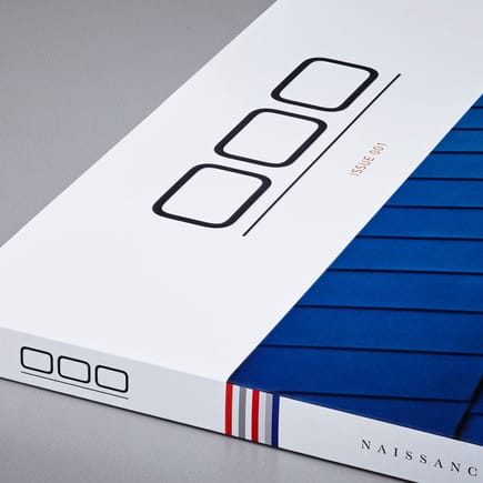 Issue 1 in soft-cover, detail; the stripes reference the colors of the featured cars within