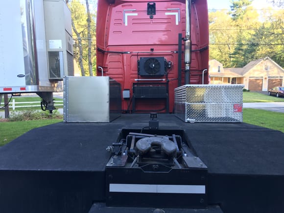 Storage bin on the left, fuel transfer tank on the right.