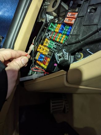 Slightly cut the hardwire blade down to match a fuse blade size, then it fit perfectly into an empty open fuse slot. See this for wiring diagram: https://www.autogenius.info/porsche-cayenne-2011-2017-fuse-box-diagram/ 