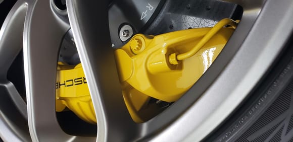OEM Spyder wheel, note inner shape of the spoke, a pocket created to clear the caliper sides, over a decent diameter range.