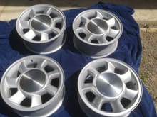 I also have a set of these original wheels and caps recently refinished in the factory for paint code, and all of the 4 lug stuff to including rear and front calipers and rotors axles and spindles that i have to sell unfortunately due to health problems