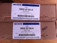 OEM Ford parts for rear caliper relocation brackets.