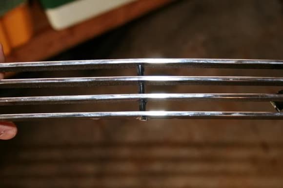GT lower grill cut in half. Use half that has the long posts.