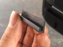 random rubber trim piece near door