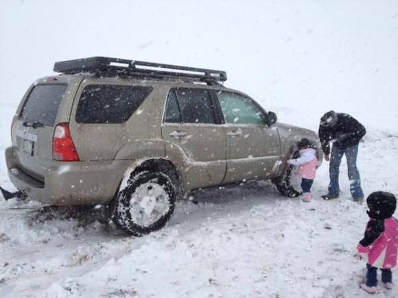 kicking the snow out of the wheels