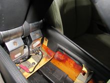 Arm rest screws to loosen to lift rear console cover. Heater duct in opening. Notice broken crossmember where pin was inserted. The fitting pulled out when removing cover. 