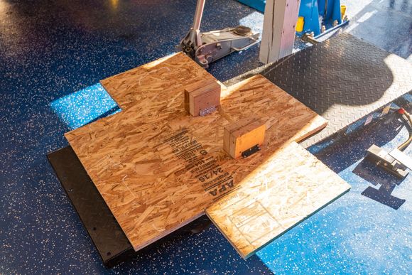 Cradle : piece of plywood with cutouts for 1] the rear suspension arms and 2] access to the engine mount nuts. Supports : 6" long X 4.6" high