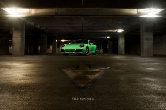 2017 Porsche 911 4s in Signal Green shot in a Parking Garage.