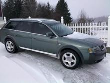 I don't have my 16 year old son trained yet.....Next time the picture will be sans snow on car.  :)