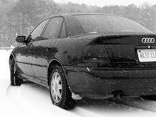 In the snow. Epic shot of the car in the snow from the rear.