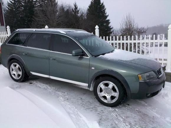 I don't have my 16 year old son trained yet.....Next time the picture will be sans snow on car.  :)