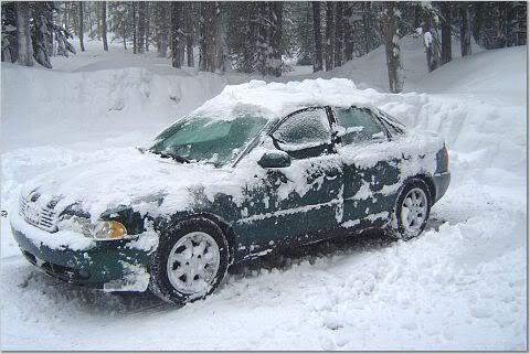 Snow Storm Pic #3.  Finishing Digging out from 18"  snow storm.  She was fully covered originally...just a huge mound of snow.  Ran like a champ, no issues.  AWD FTW!