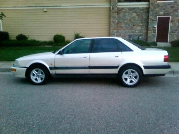 Driver's side view....see how the front bumper sags and is out of alignment!!