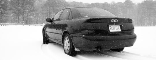 In the snow. Epic shot of the car in the snow from the rear.