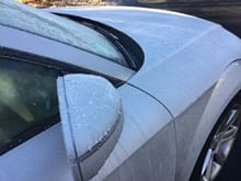 Ice crystals dancing on a well waxed car