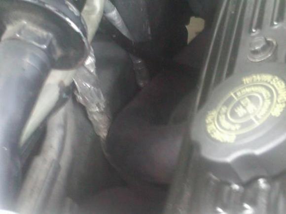 This is proof of why u don't pay lazy people to work on your car!!! If u look close, u will see 2 wiring bundles from the harness, and they're both wrapped in heat tape, but they're both pinned between the panel and the header tubes!!!!! I don't think anybody with a brain would leave it like that, so my plan? Time to inspect the wires, fix, extend and reroute. Oh did I mention that some of those wire go straight to the computer?????