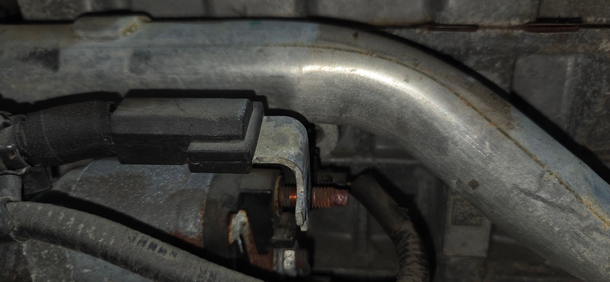 Photo taken during my starter replacement - the aluminum boss is in the background.